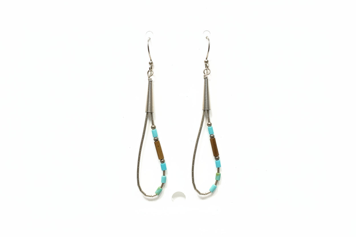 Two beaded earrings on a white card