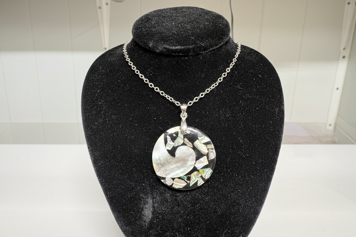 Jewelry with a circular design on a black stand