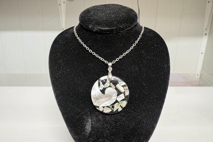 Jewelry with a circular design on a black stand