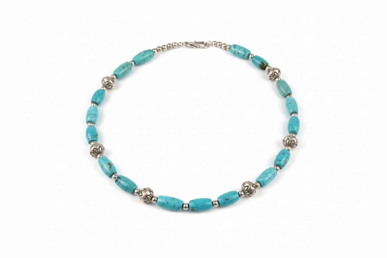 Turquoise beaded necklace on a white surface