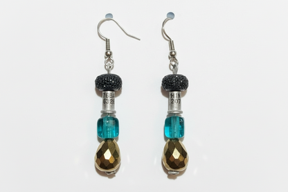 Pair of earrings with blue and brown beads on a white background