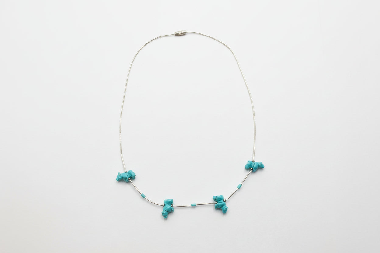 Necklace with turquoise beads on a white background