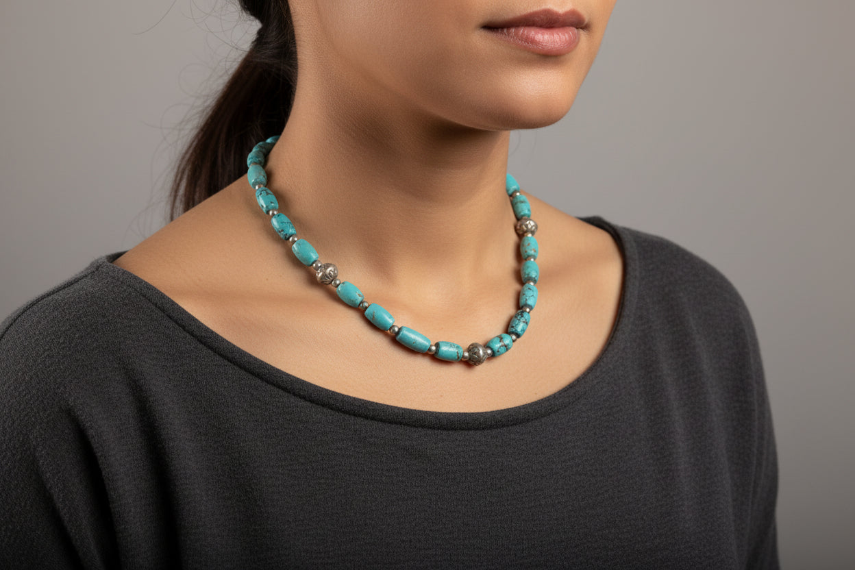 Turquoise beaded necklace on a white background