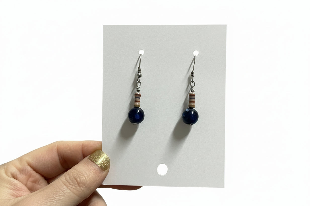 Pair of beaded earrings on a display card