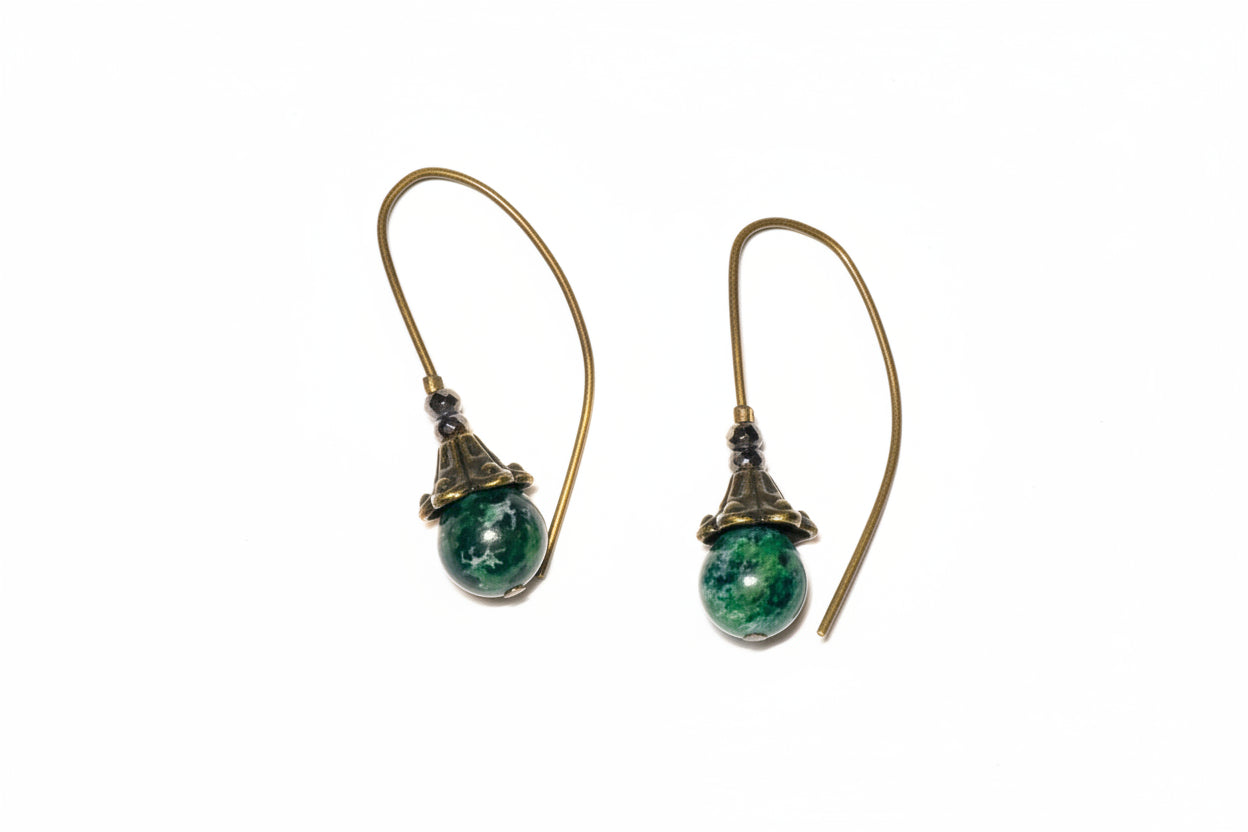 Malachite earrings with green gemstones on a white background