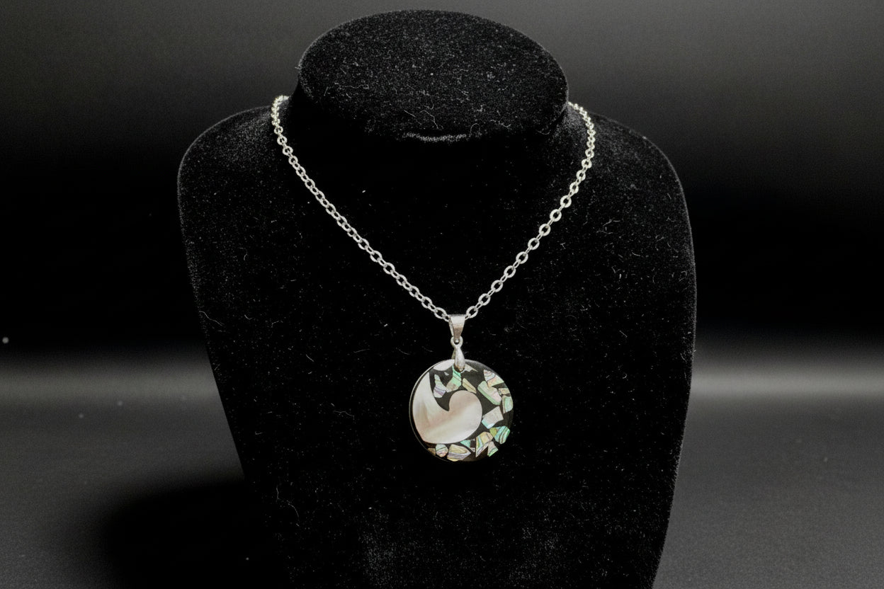 Necklace with a multicolored pendant on a black stand