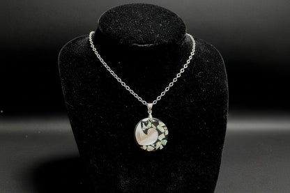 Necklace with a multicolored pendant on a black stand