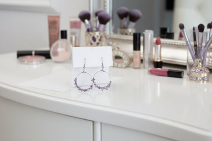Silver hoop earrings with purple and silver beads 