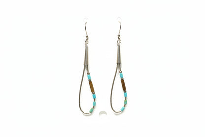 Two beaded earrings on a white card 