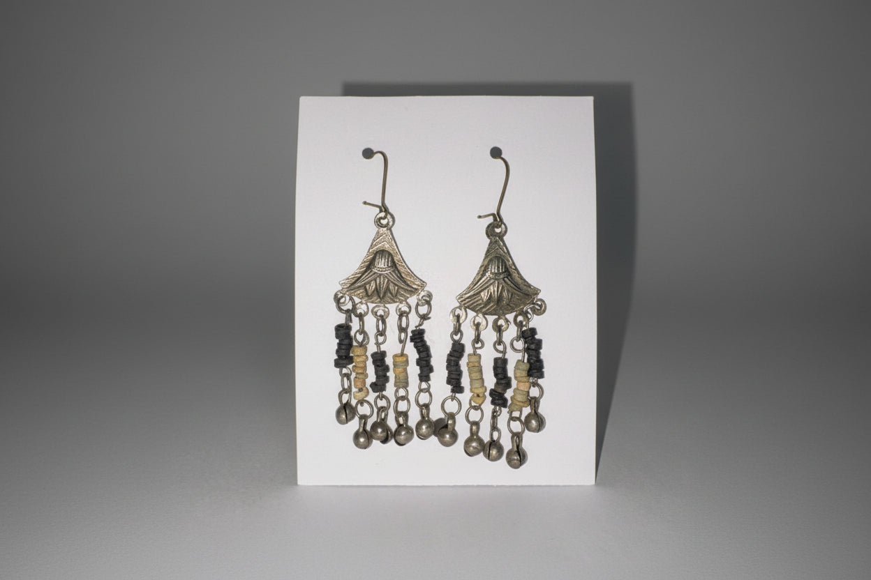 Decorative earrings on a white card
