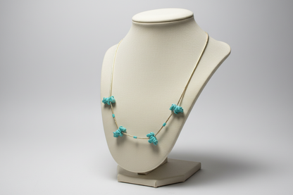 Necklace with turquoise stones on a black background