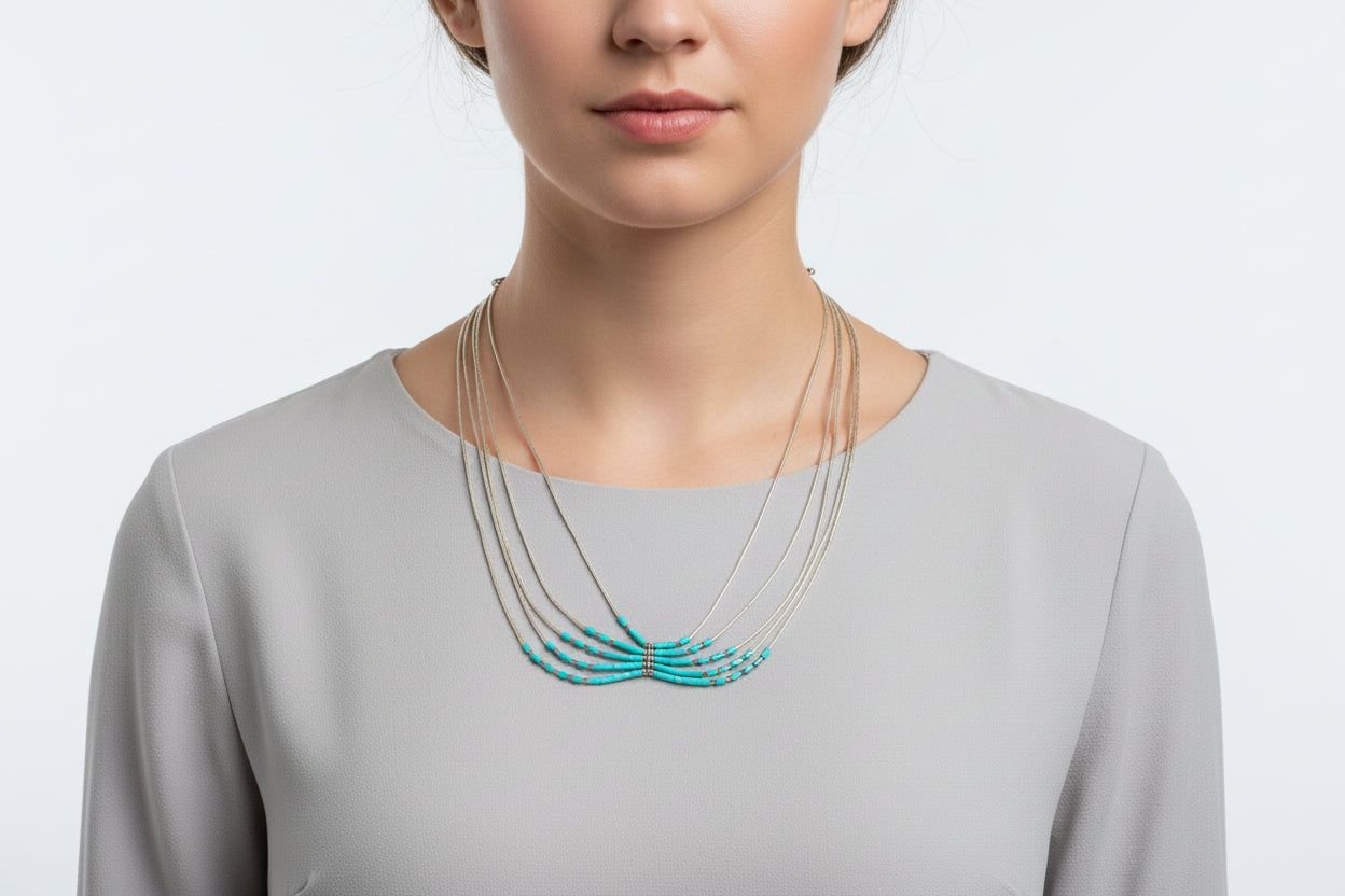 Set of necklaces on a black stand with a blurred background