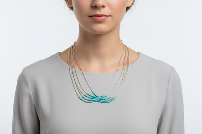 Set of necklaces on a black stand with a blurred background