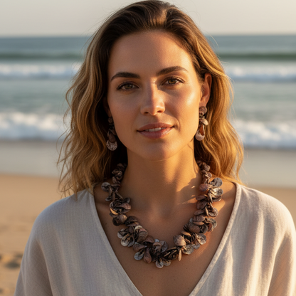 Woman wearing a necklace on a beach