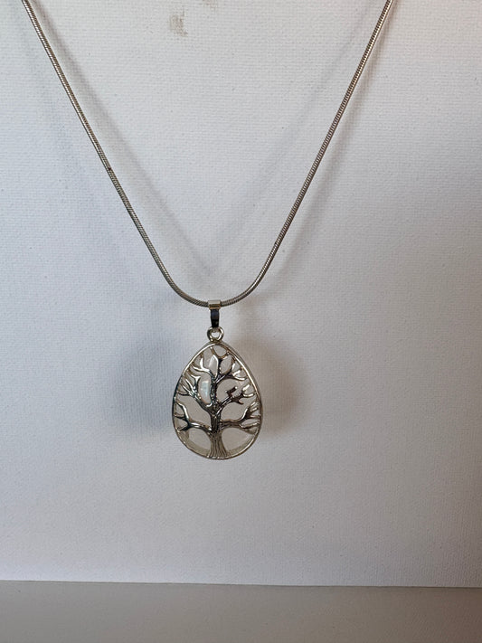 Silver necklace with a detailed pendant on a white background